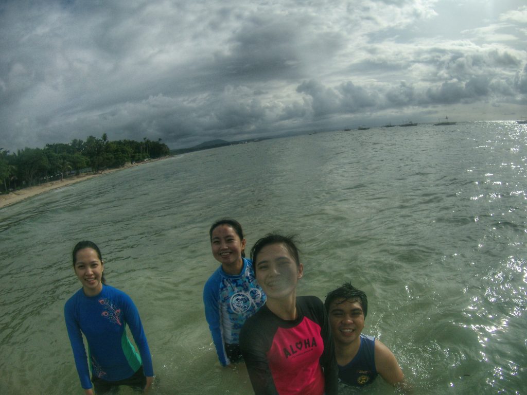 enjoying the beach with friends at a panglao bohol beach resort