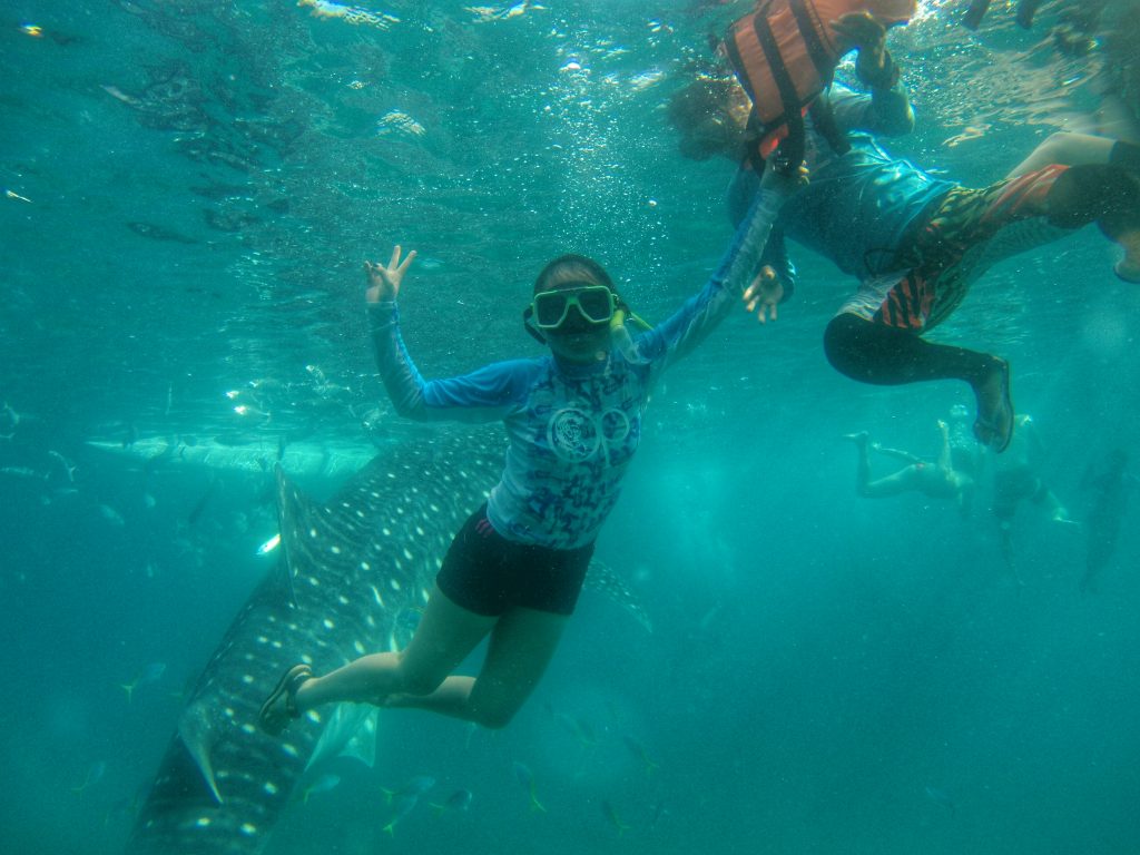trying my best to swim down with the boatman's help by pushing me