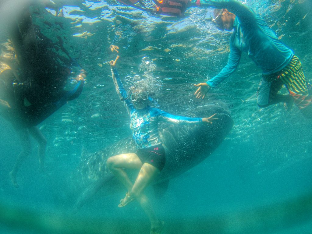 trying my best to swim down with the boatman's help by pushing me