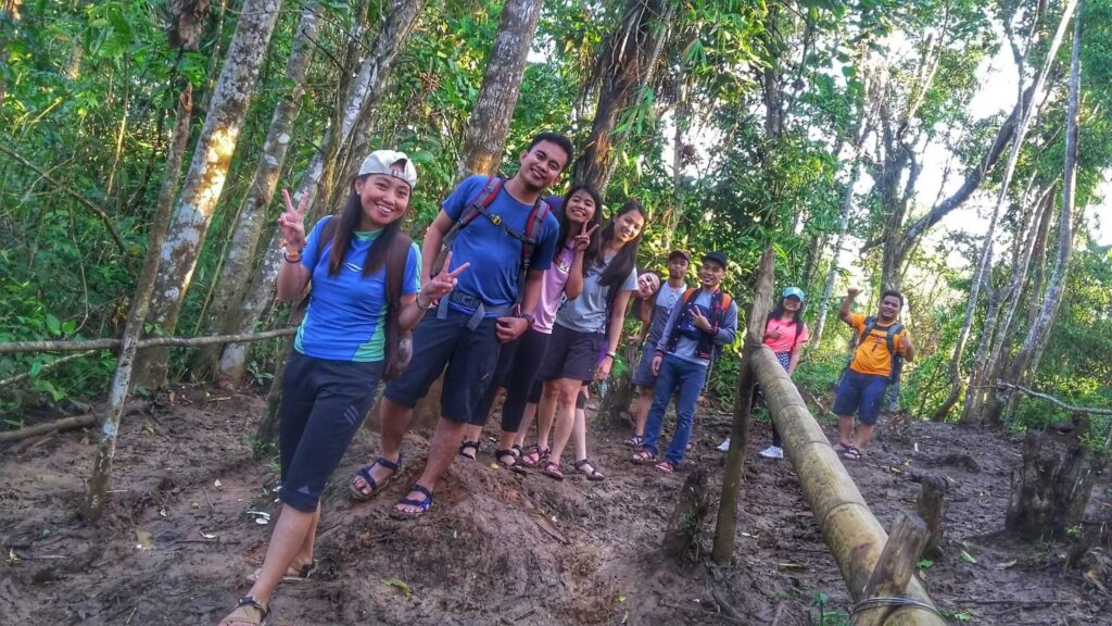 trekking on a muddy trail going to Hulugan Falls in Laguna