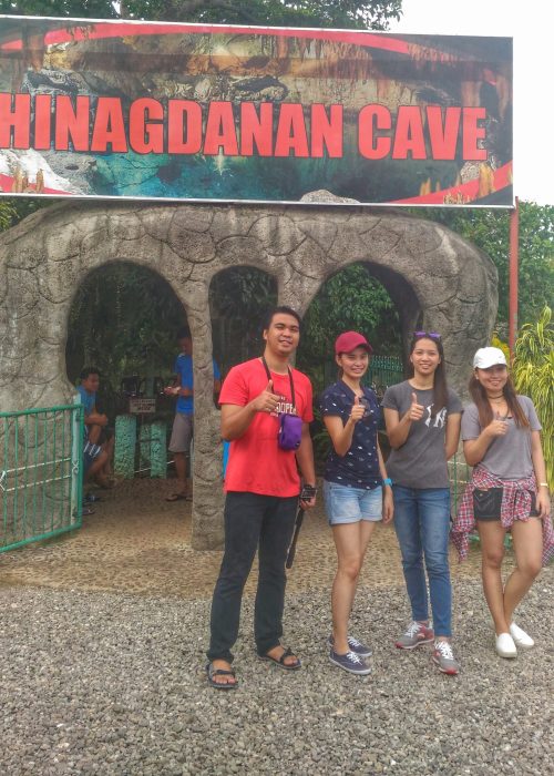 our group picture in front of the entrance of hinagdanan cave